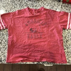 NWOT AMERICAN EAGLE PEANUTS WOODSTOCK FOOTBALL TEE